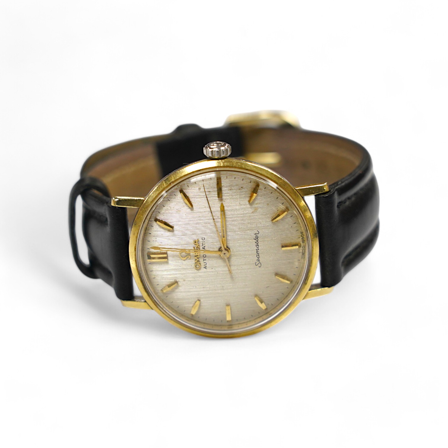 A gentleman's steel and gold plated Omega Seamaster automatic wrist watch, on an associated leather strap, case diameter 34mm, with engraved inscription. Condition - poor to fair